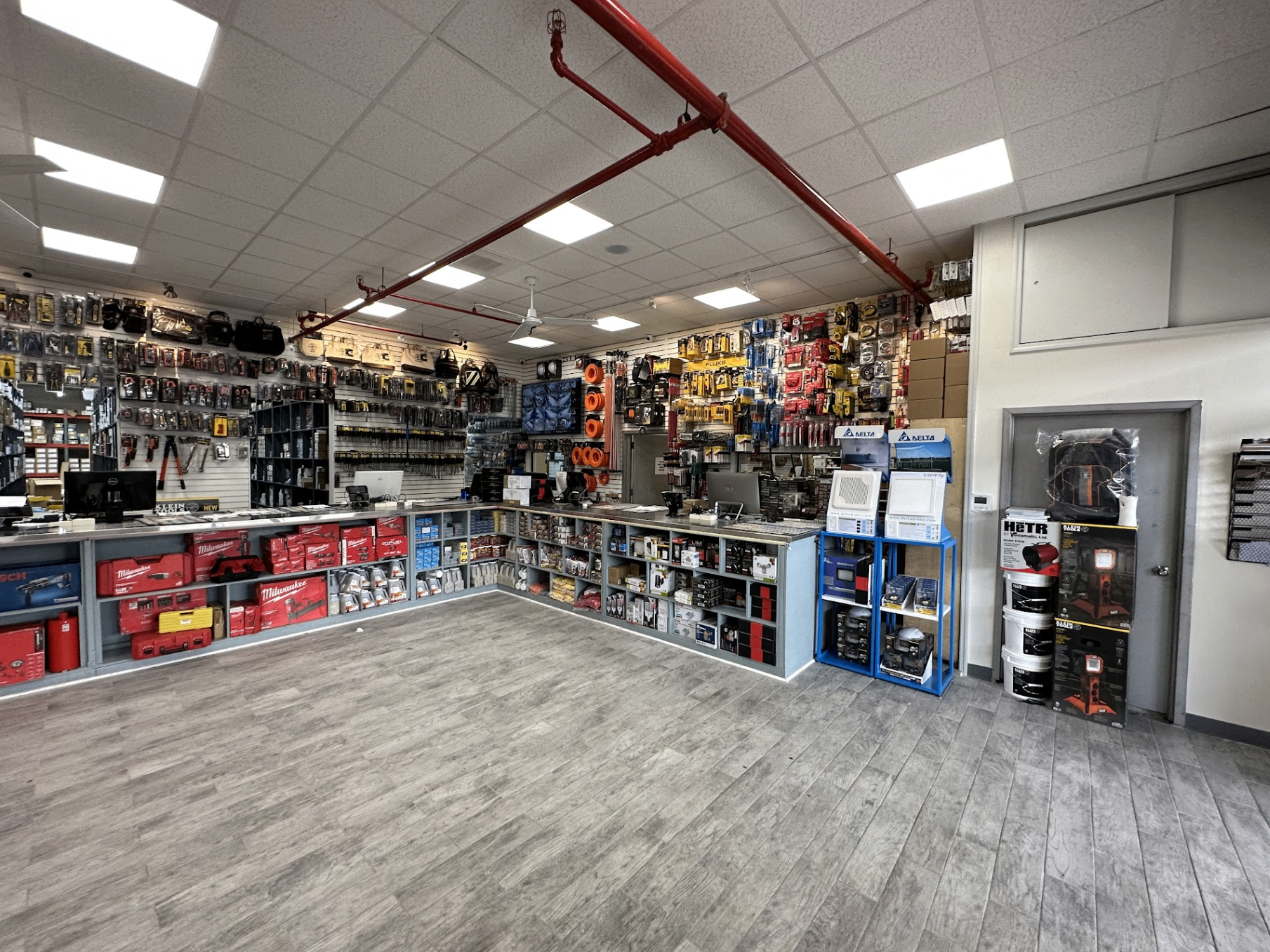 Inside Jamaica Electrical Supply — Milwaukee, Klein, Fluke, Delta and more on the walls