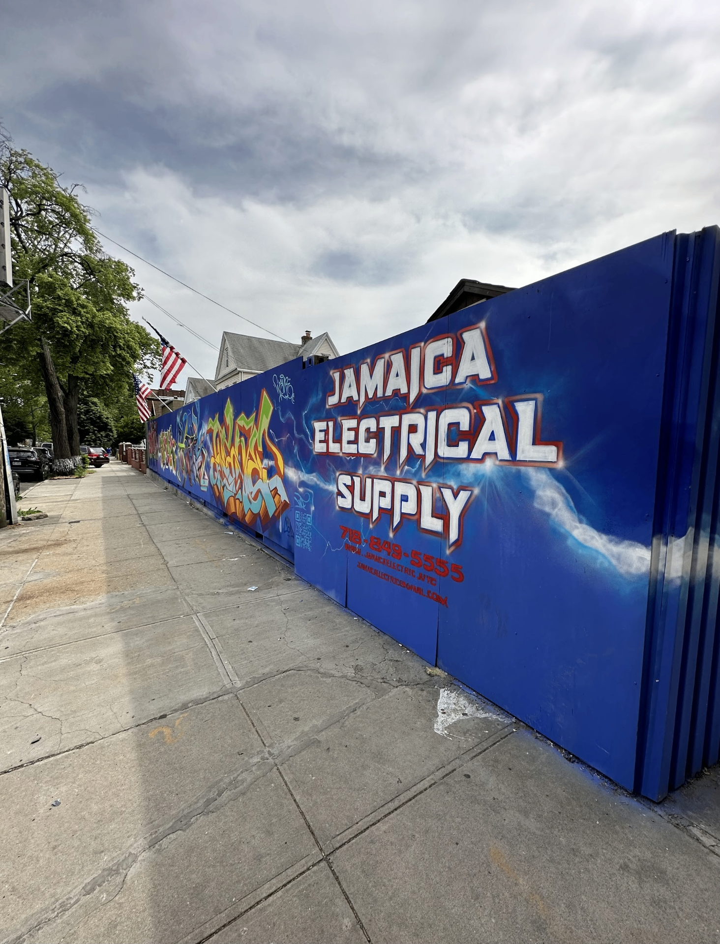 Jamaica Electrical Supply mural with logo and lightning